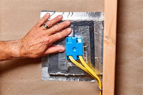 blown in insulation around electrical boxes|electrical boxes in insulation.